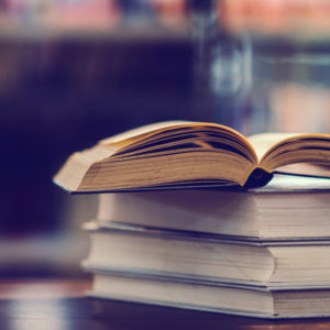 Book in library with open textbook,education learning concept Día del Profesor